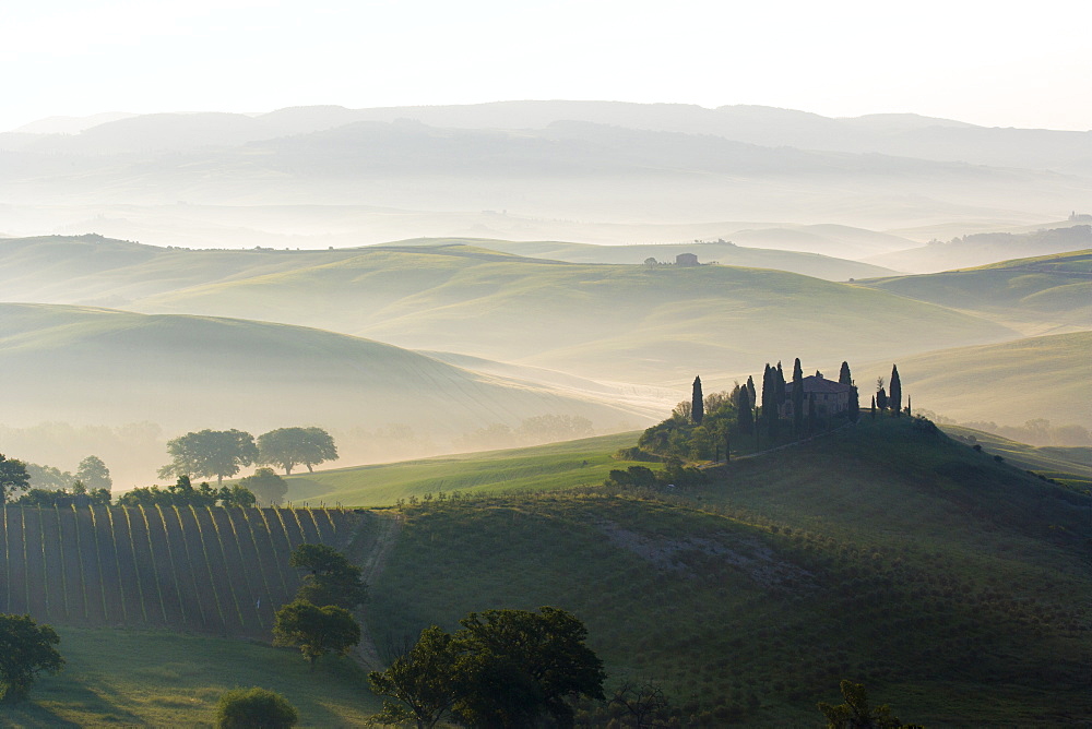 Podere Belvedere and misty hills at sunrise, Val d'Orcia, San Quirico d'Orcia, UNESCO World Heritage Site, Tuscany, Italy, Europe