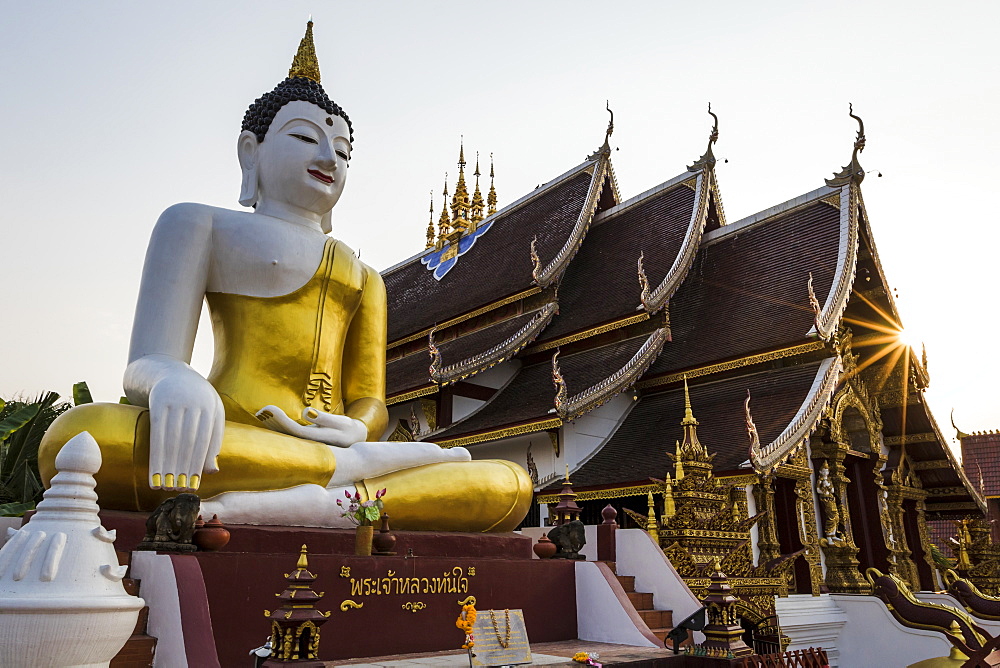 The Buddha and Wat Rajamontean with a sunburst, Chiang Mai, Thailand, Southeast Asia, Asia