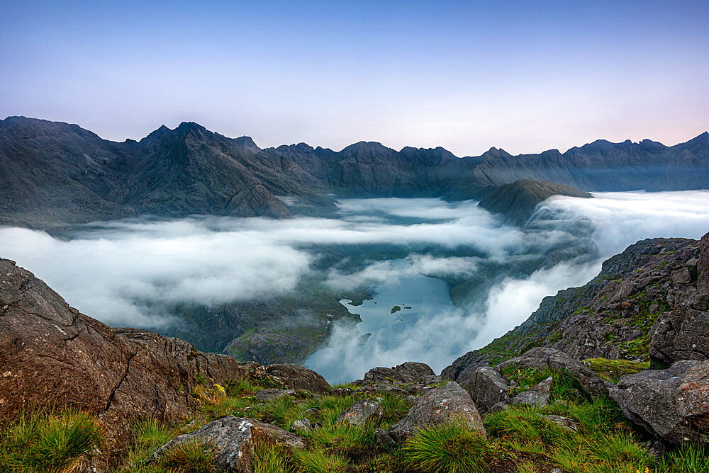 Early morning clouds drifting over the hills flowing down to Loch Coruisk below with the Cuillin Ridge in the background, Isle of Skye, Inner Hebrides, Scotland, United Kingdom, Europe