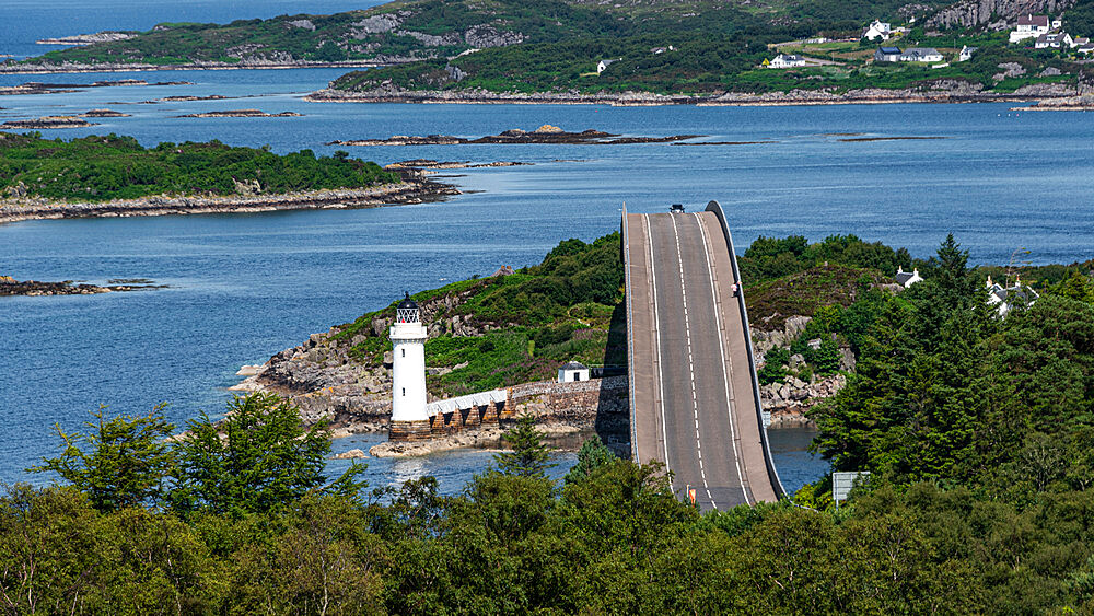 The Skye Bridge over Loch Alsh, connecting the Isle of Skye to Eilean Ban and the mainland, with Kyleakin Lighthouse on the island, Inner Hebrides, Scotland, United Kingdom, Europe