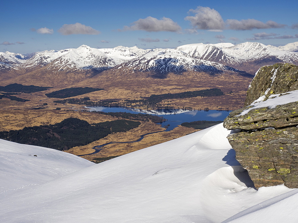 Loch Tulla and the snow capped Blackmount viewed from Beinn Dorain near Bridge of Orchy in the Scottish Highlands, Scotland, United Kingdom, Europe