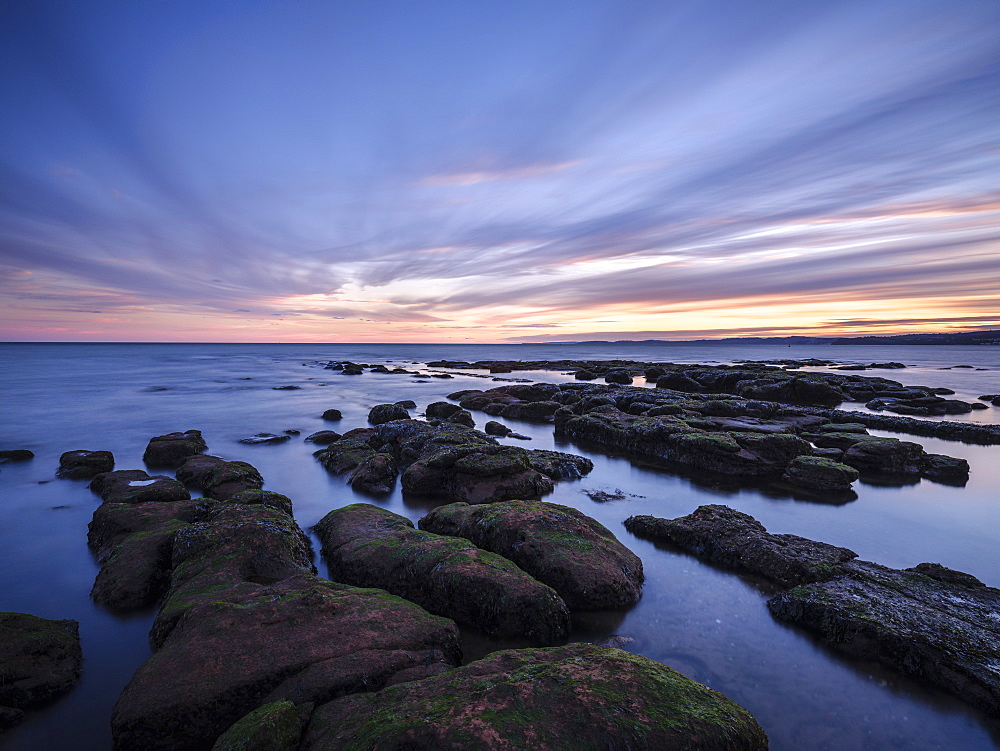 Maer Rocks in evening twilight close to the RNLI station, Exmouth, Devon, England, United Kingdom, Europe