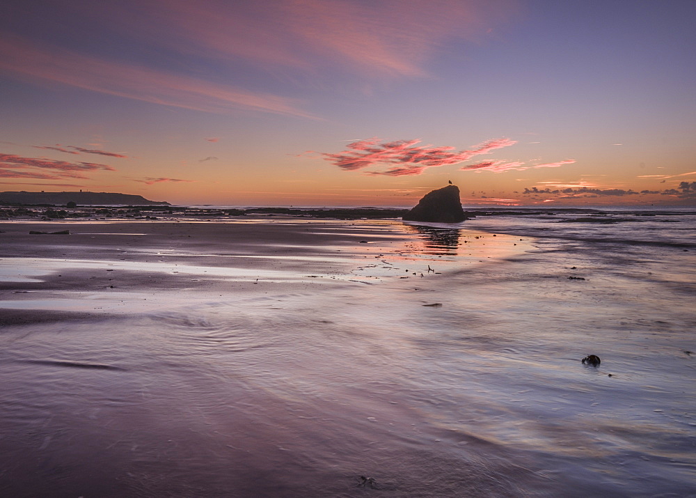 Vivid dawn cloud formation and wet sand, Sandy Bay, Orcombe Point, Exmouth, Devon, England, United Kingdom, Europe