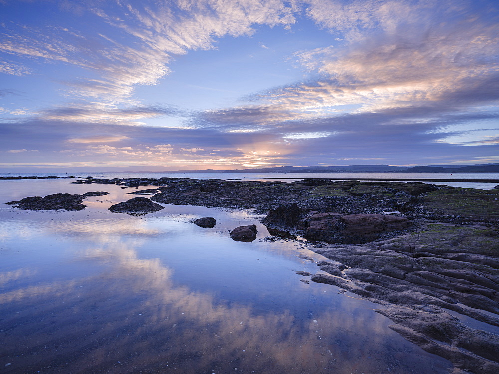 Winter sunset viewed from Maer Rocks, near Orcombe Point, Exmouth, Devon, England, United Kingdom, Europe