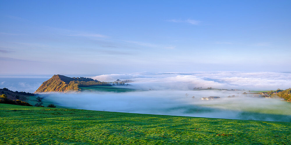 Spring with extensive fog and mist over Otterton and Ladram Bay viewed from Peak Hill, Sidmouth, Devon, England, United Kingdom, Europe