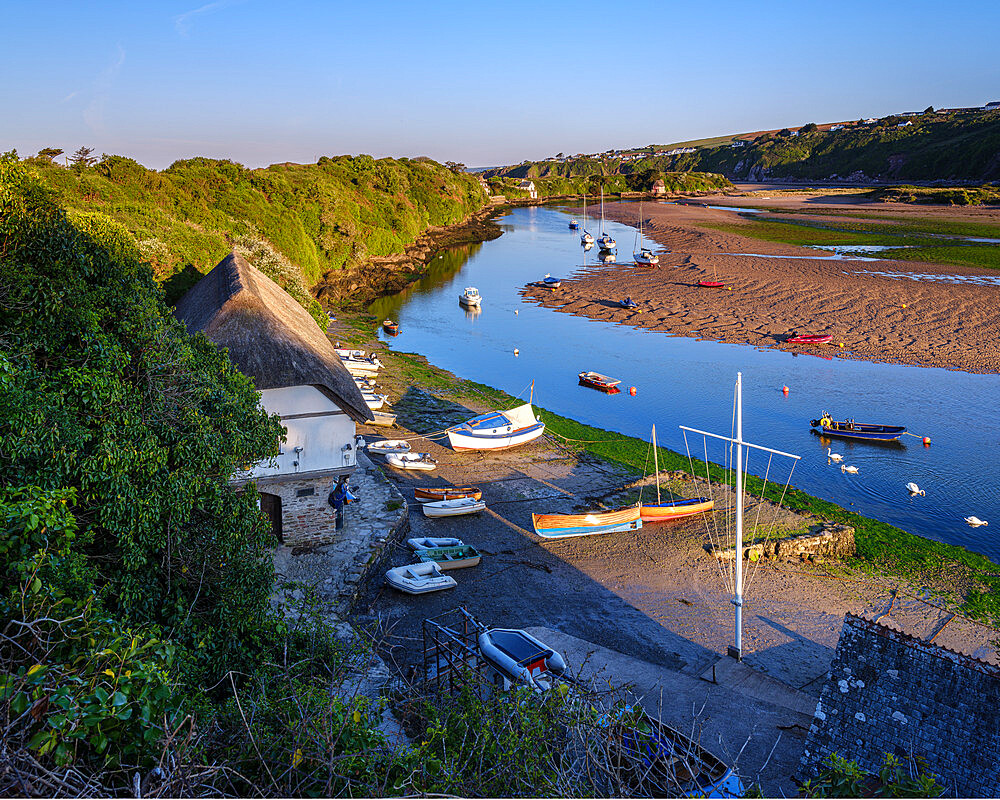 Scene overlooking Bantham Quay with array of boats and River Avon at Bantham, Devon, England, United Kingdom, Europe