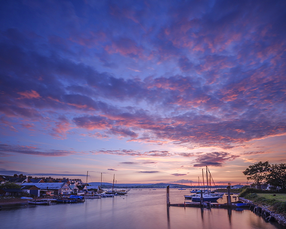 Sunset with boats on the Exe shoreline at the back of Camperdown Terrace, Exmouth, Devon, England, United Kingdom, Europe