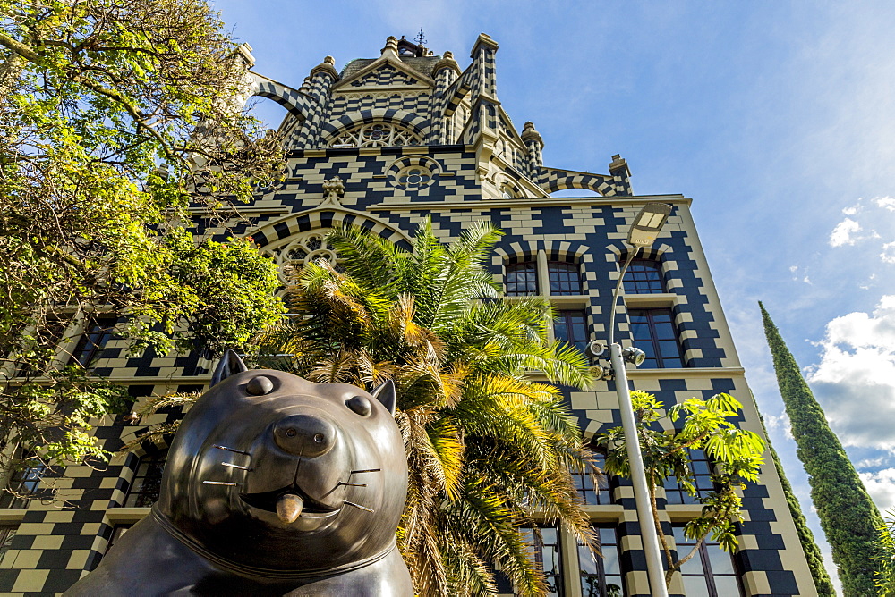 A view of the Rafael Uribe Uribe Palace of Culture with the Fernando Botero statue Perro (Dog) in the foreground, Medellin, Colombia, South America