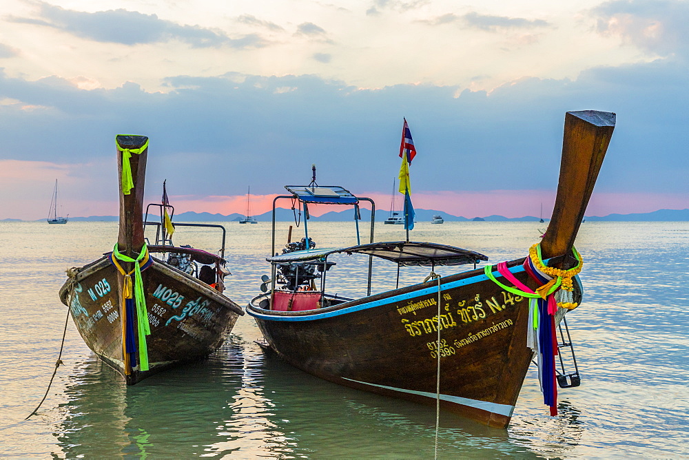 Long tail boats at sunset on Railay beach in Railay, Ao Nang, Krabi Province, Thailand, Southeast Asia, Asia