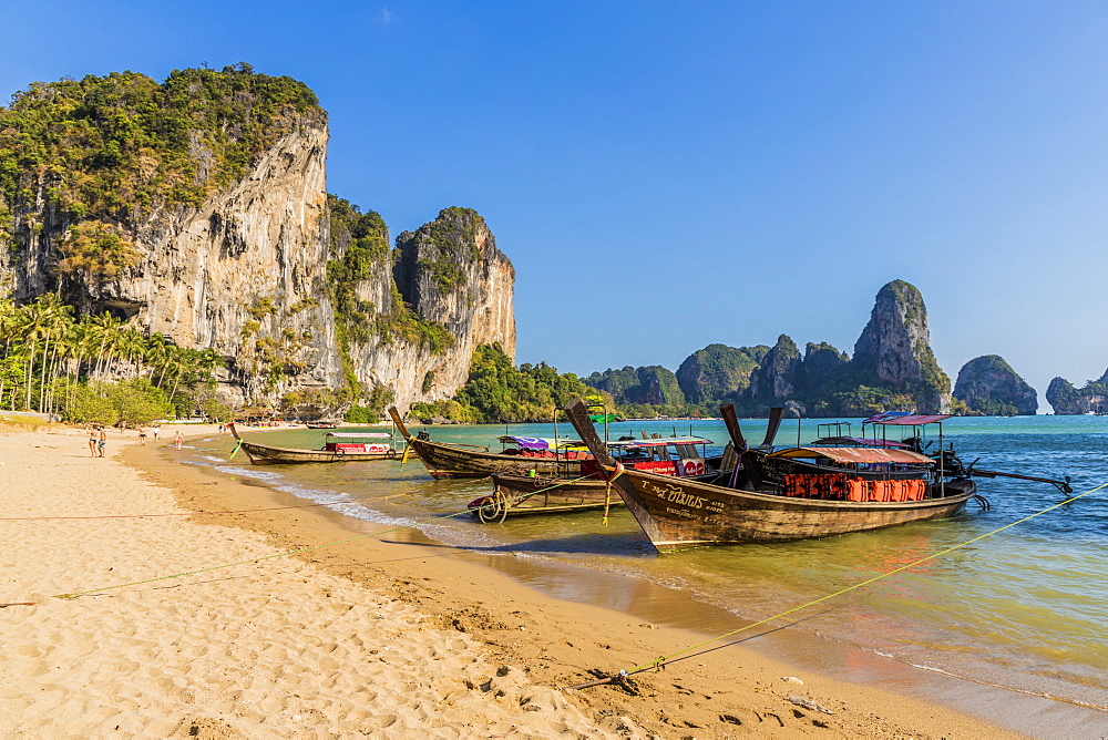 Long tail boats on Tonsai beach and karst landscape in Railay, Ao Nang, Krabi Province, Thailand, Southeast Asia, Asia