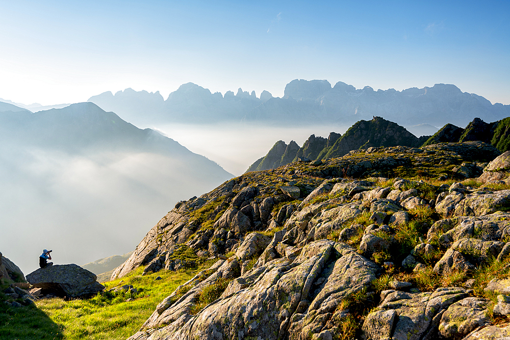 Photographer in Brenta Dolomites in summer season, Trentino Alto Adige, Italy, Europe