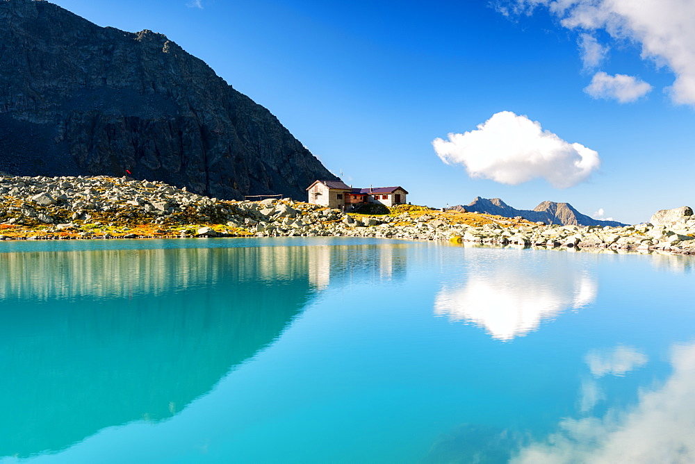 Tonolini Refuge at mirror in Adamello park, Vallecamonica (Val Camonica), Brescia province, Lombardy district, Italy, Europe