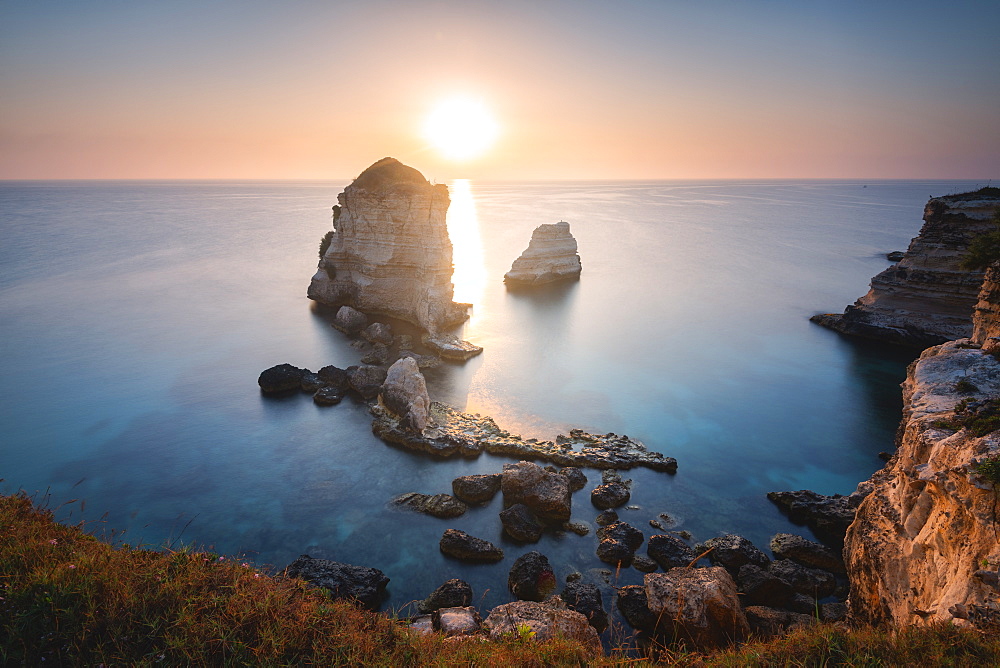 Sunrise at the Faraglioni of Torre dell'Orso, Meledugno, Lecce province, Apulia, Italy, Europe