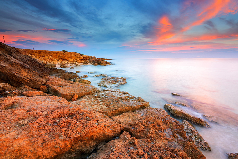 Rocks on the Salento coast at sunset, Dunes of Campomarino, Taranto province, Apulia, Italy, Europe