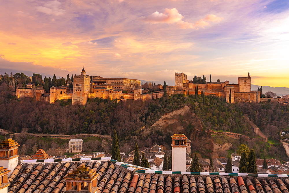 View of the Alhambra, UNESCO World Heritage Site, with the Sierra Nevada mountains in the background, at sunset, Granada, Andalucia, Spain, Europe