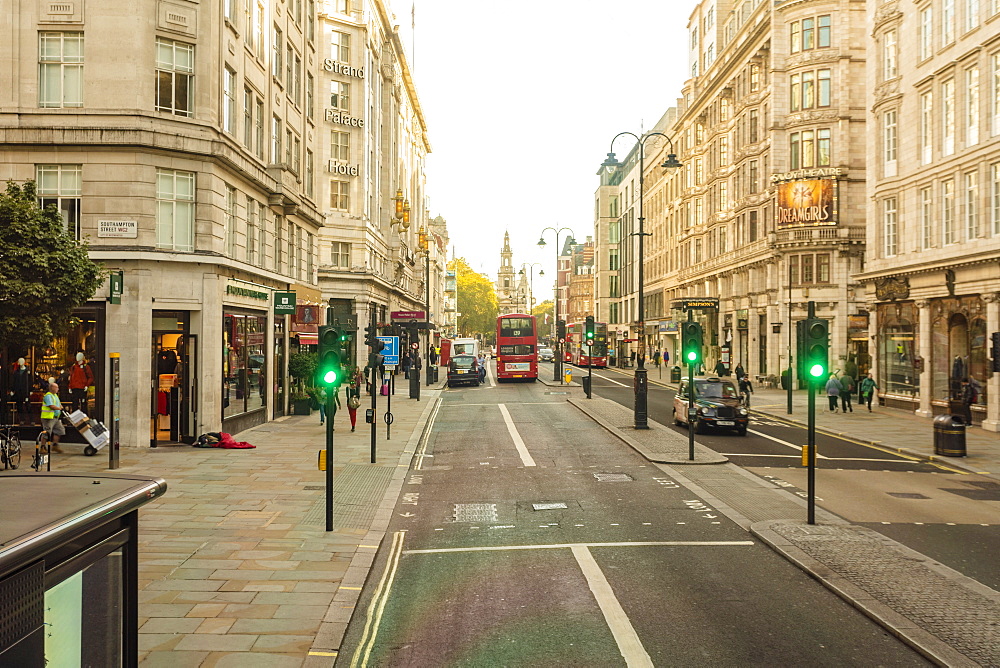 The Strand with the St. Clement Danes, Central Church of The Royal Air Force, in the background on a sunny day, London, England, United Kingdom, Europe