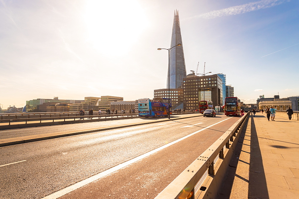 London Bridge with red buses and The Shard in the background, London, England, United Kingdom, Europe