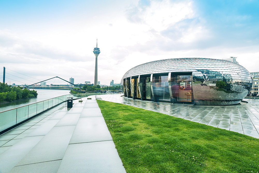 Gehry Buildings and Media Hafen with the TV tower of Dusseldorf in the background, Dusseldorf, North Rhine-Westphalia, Germany, Europe