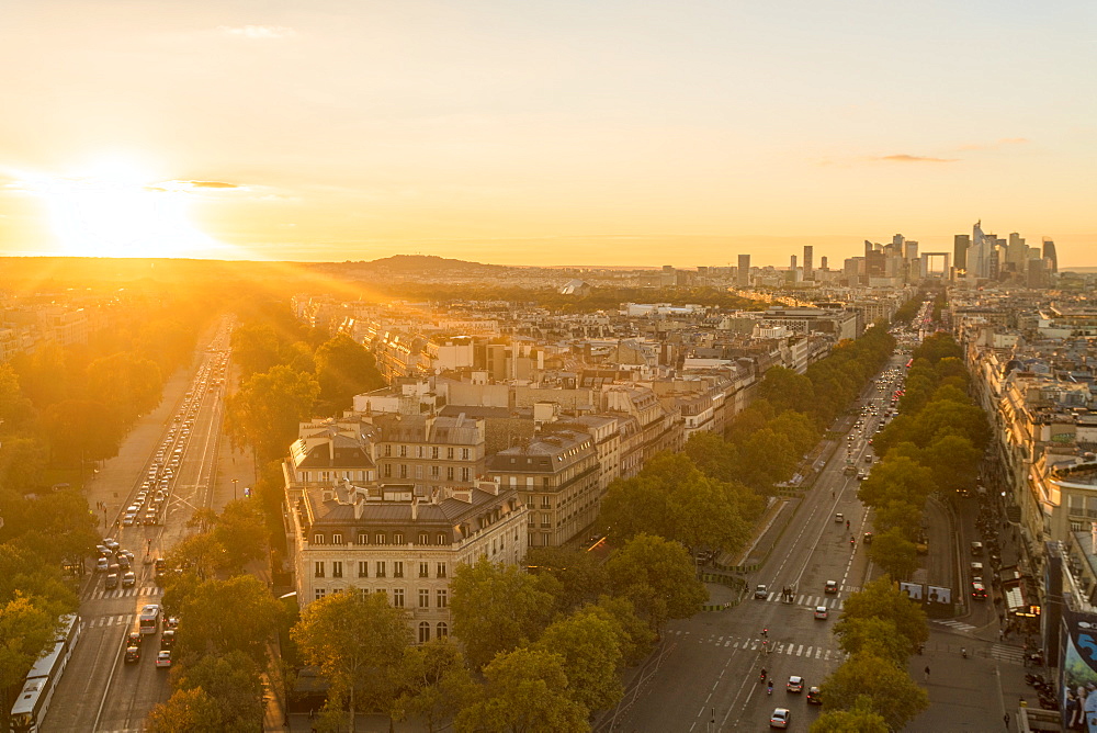 View from Arc de Triomphe at sunset, with La Defense in the distance on the right, Paris, France, Europe