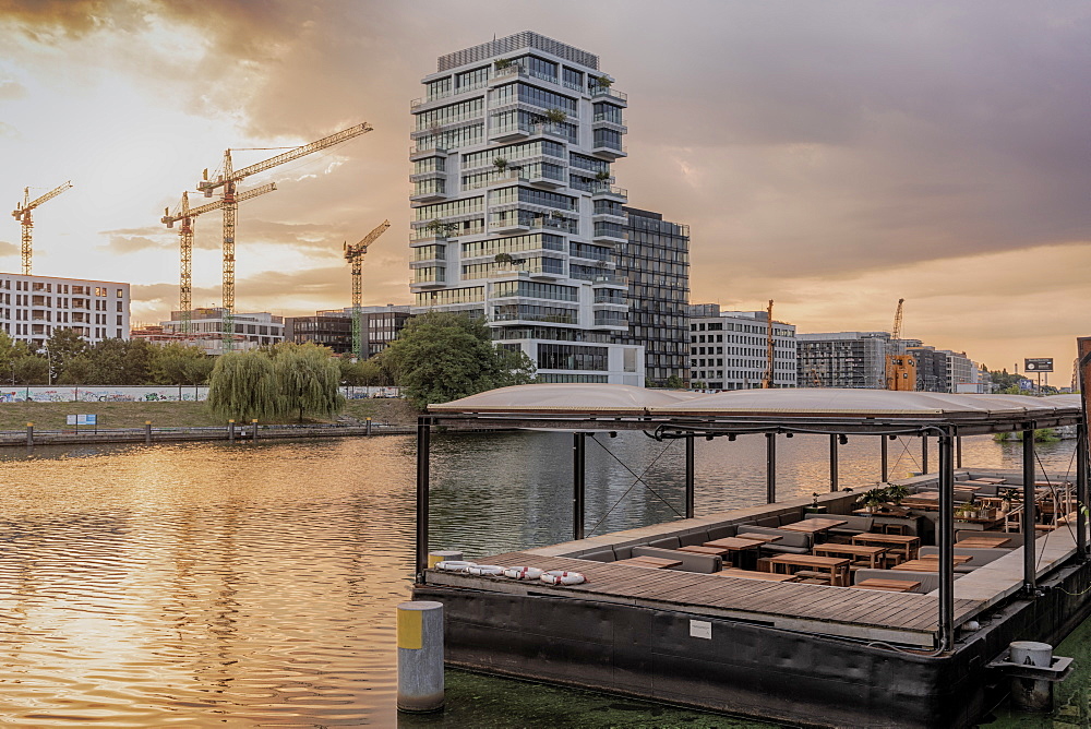 View of the Spree River after sunrise in Berlin with modern buildings in the background, Berlin, Germany, Europe