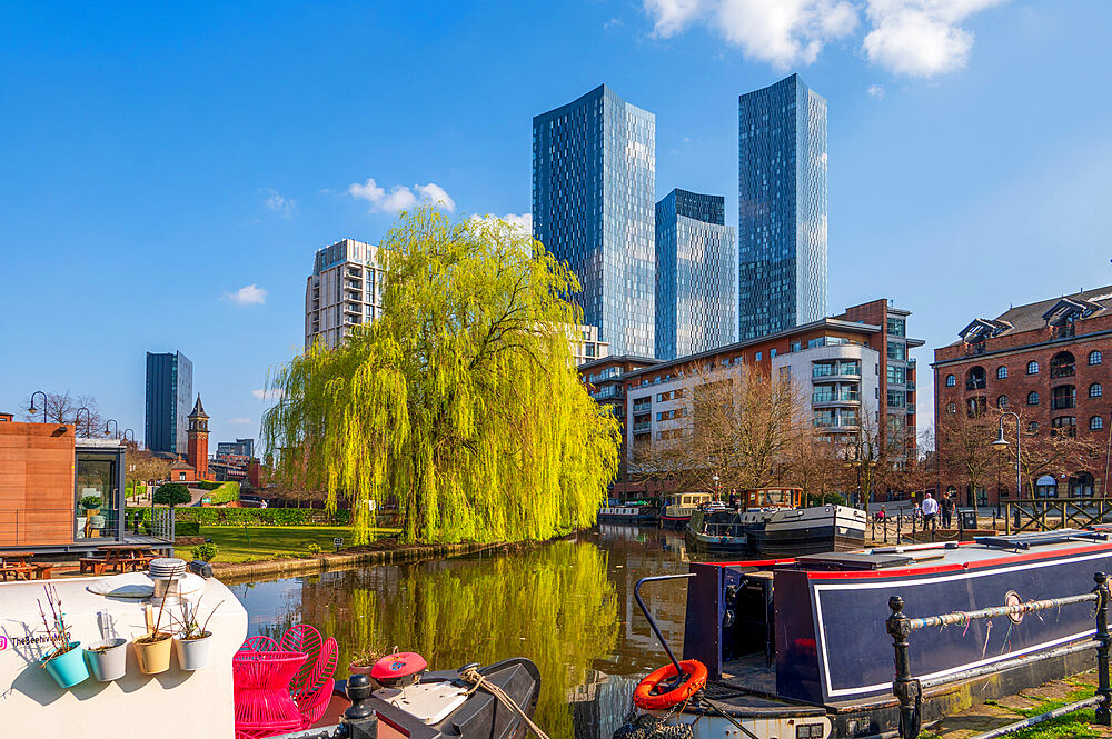 Skyscrapers reflected at Castlefield Basin with canal barges, Manchester, England, United Kingdom, Europe