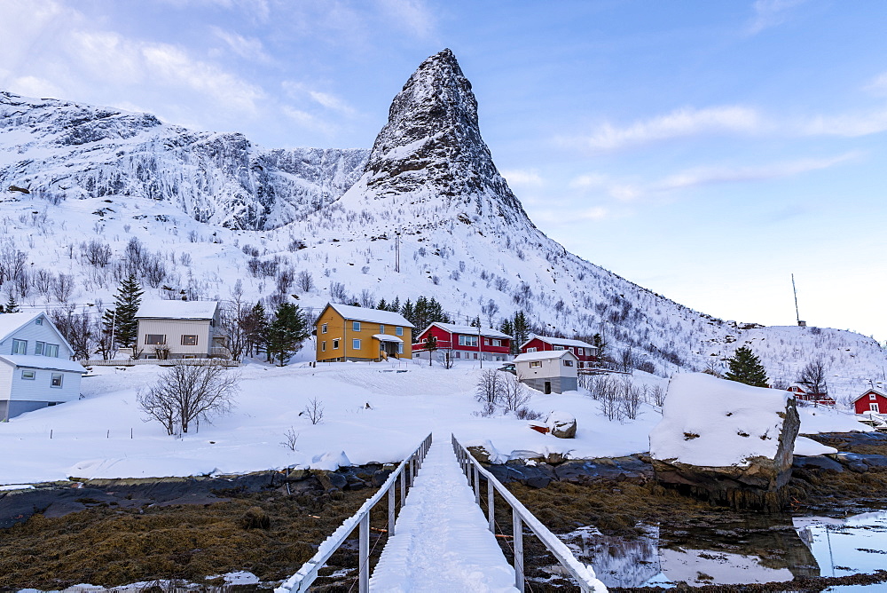 Pointed mountain of Reine with footbridge in winter, Reine, Lofoten, Nordland, Arctic, Norway, Europe