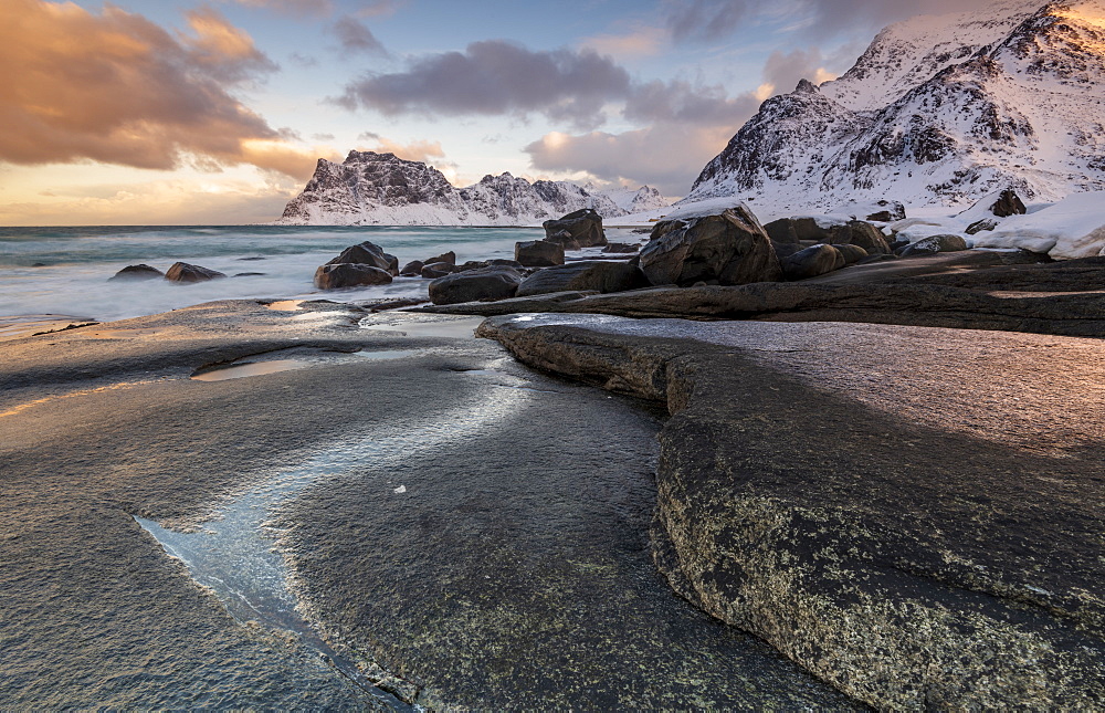 Dramatic rock formation in winter at Haukland Beach, Lofoten, Nordland, Norway, Europe