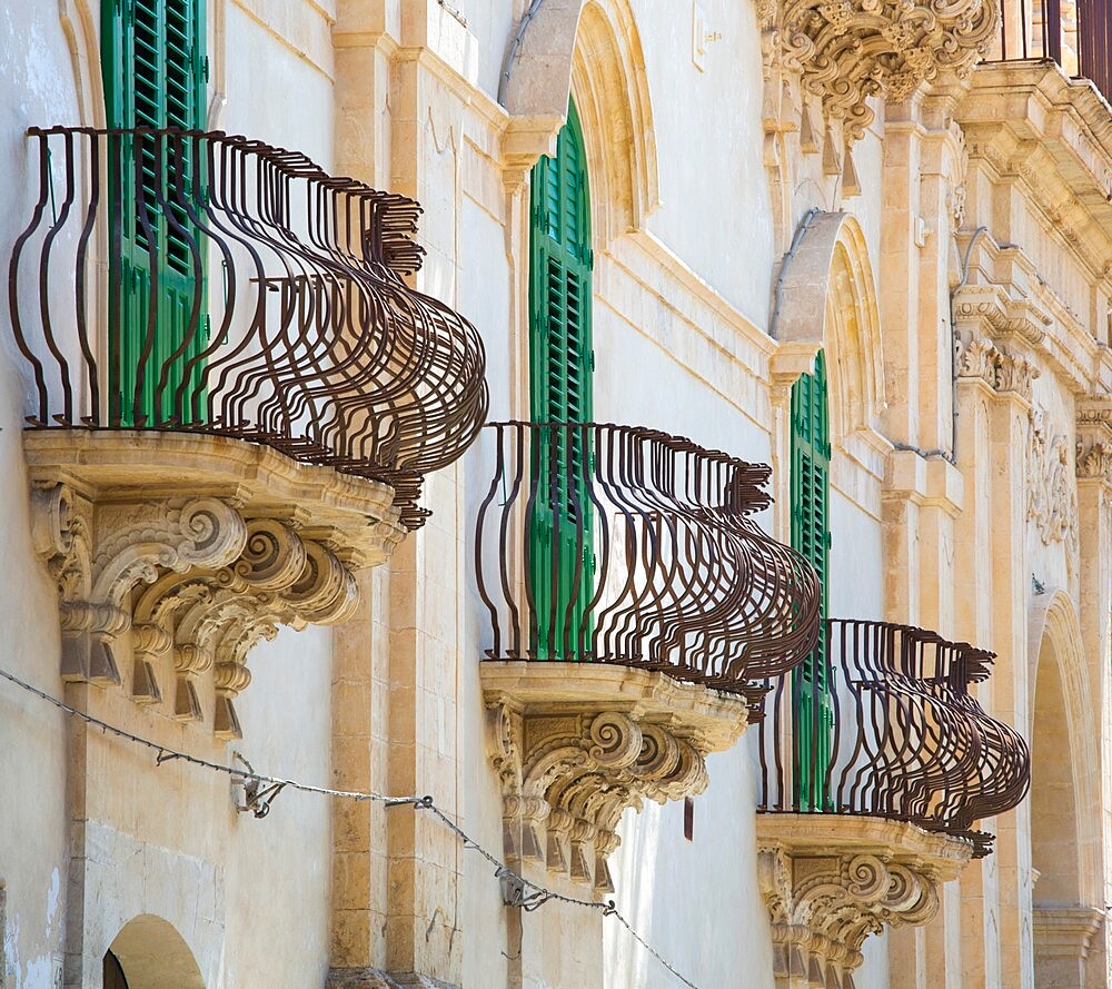 Typical wrought iron balconies on the baroque Palazzo Astuto di Fargione, Noto, UNESCO World Heritage Site, Syracuse (Siracusa), Sicily, Italy, Europe