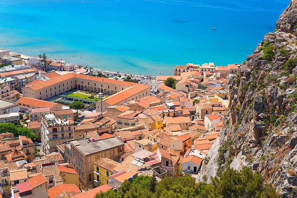 View from La Rocca over tiled rooftops to the calm turquoise waters of the Tyrrhenian Sea, Cefalu, Palermo, Sicily, Italy, Mediterranean, Europe