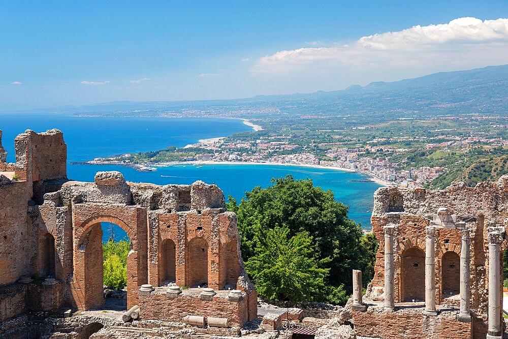 View from the Greek Theatre over the Bay of Naxos to distant Giardini-Naxos, Taormina, Messina, Sicily, Italy, Mediterranean, Europe