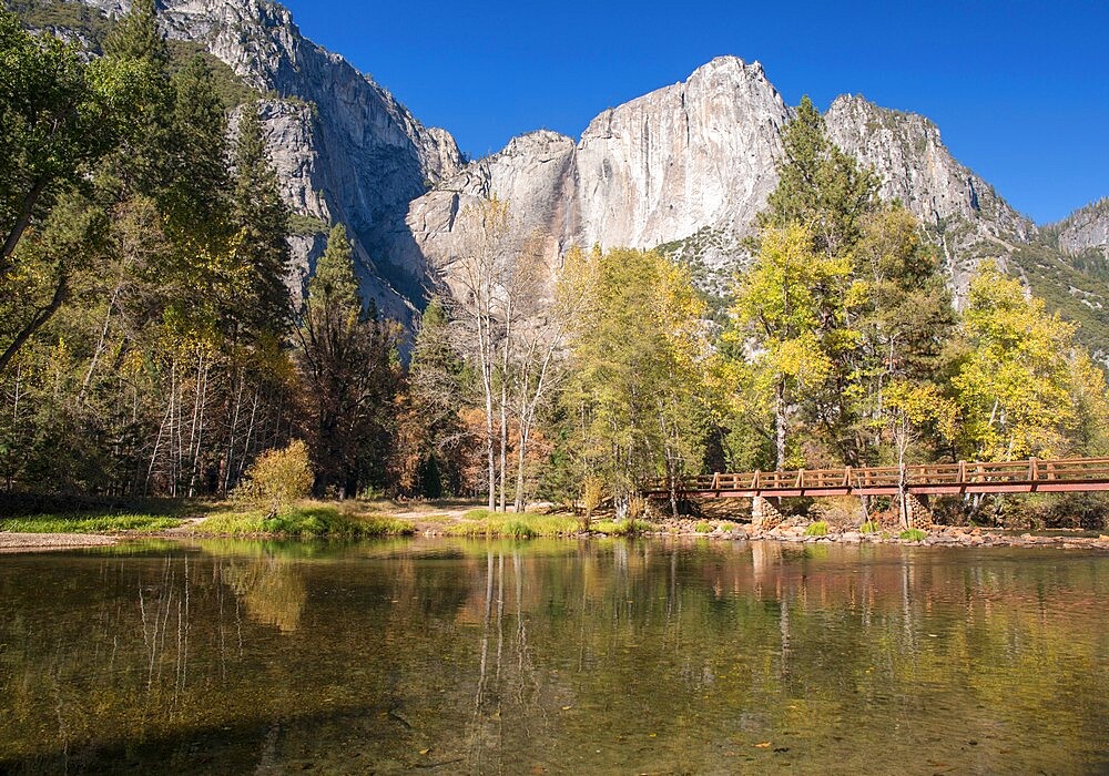 View across the tranquil Merced River below Swinging Bridge, autumn, Yosemite Village, Yosemite National Park, UNESCO World Heritage Site, California, United States of America, North America