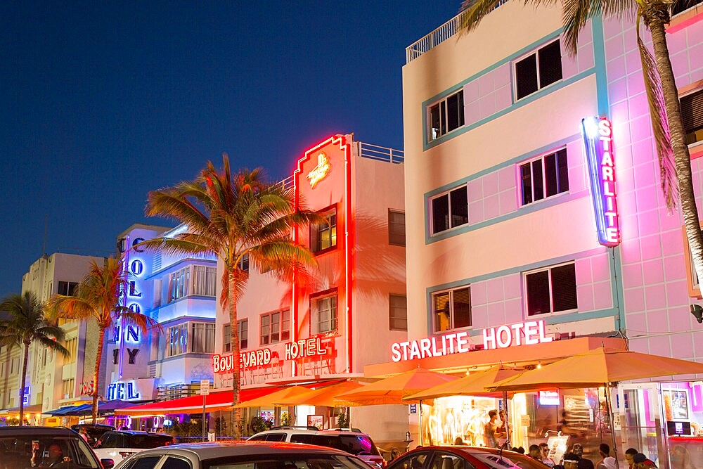 Colourful hotel facades illuminated by night, Ocean Drive, Art Deco Historic District, South Beach, Miami Beach, Florida, United States of America, North America