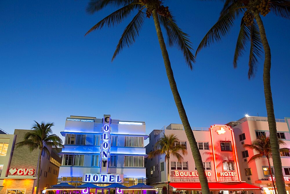 Colourful hotel facades illuminated by night, Ocean Drive, Art Deco Historic District, South Beach, Miami Beach, Florida, United States of America, North America