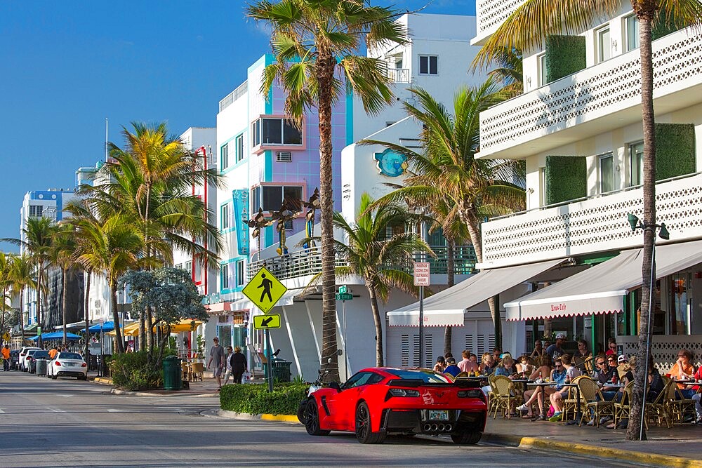 View along Ocean Drive, red Chevrolet Corvette prominent, Art Deco Historic District, South Beach, Miami Beach, Florida, United States of America, North America