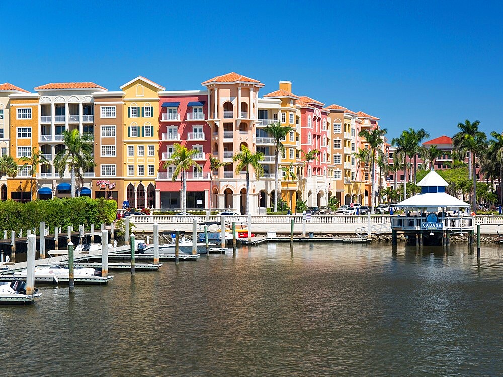 View across the Gordon River to the colourful architecture of Bayfront Place, Naples, Florida, United States of America, North America