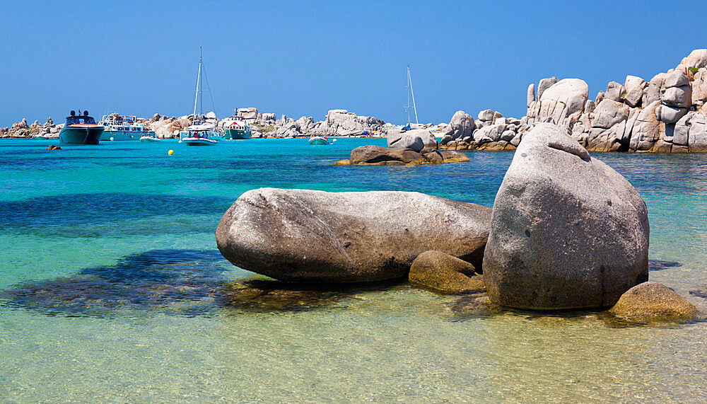 Granite boulders in the tranquil waters of Cala Lazarina, Lavezzu, Lavezzi Islands, Bonifacio, Corse-du-Sud, Corsica, France, Mediterranean, Europe