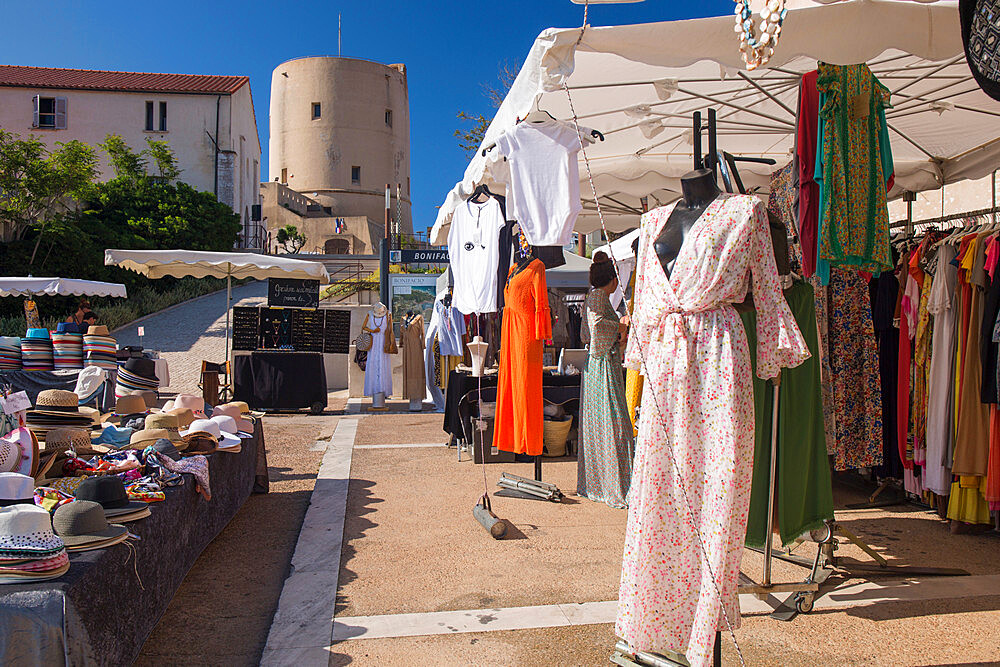 Colourful market in Place de l'Europe, the 15th century Torrione watchtower beyond, Bonifacio, Corse-du-Sud, Corsica, France, Mediterranean, Europe