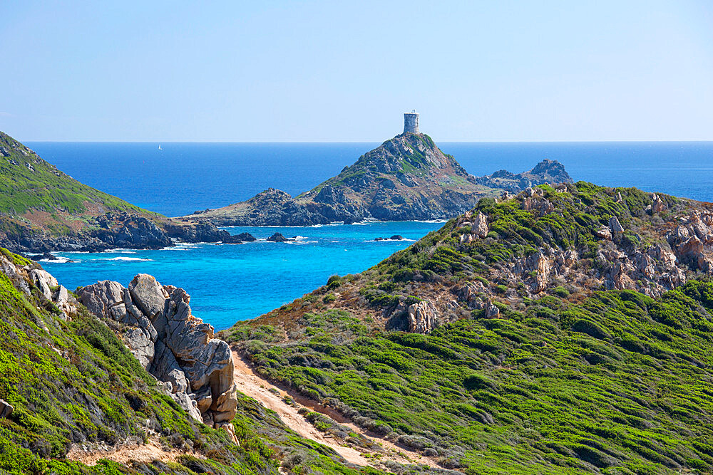 View from hillside across bay to the ruined Genoese watchtower at Pointe de la Parata, Ajaccio, Corse-du-Sud, Corsica, France, Mediterranean, Europe