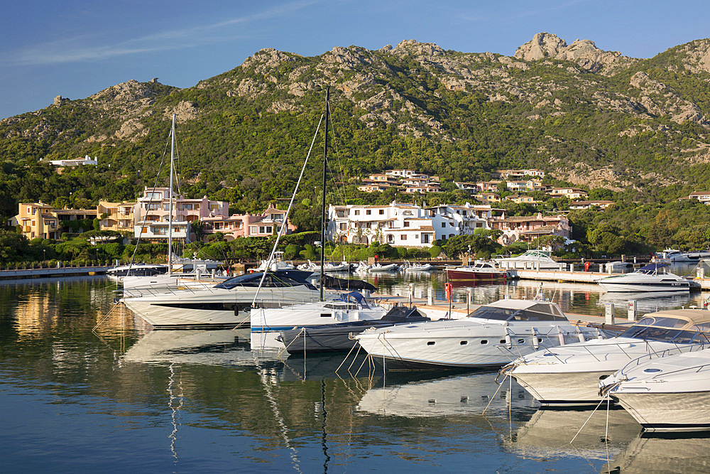 View across the still waters of the marina, early morning, Porto Cervo, Arzachena, Sassari, Sardinia, Italy, Mediterranean, Europe