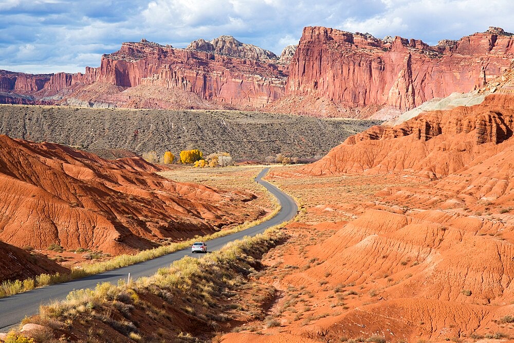 Car heading north along the Scenic Drive towards the Waterpocket Fold, Fruita, Capitol Reef National Park, Utah, United States of America, North America