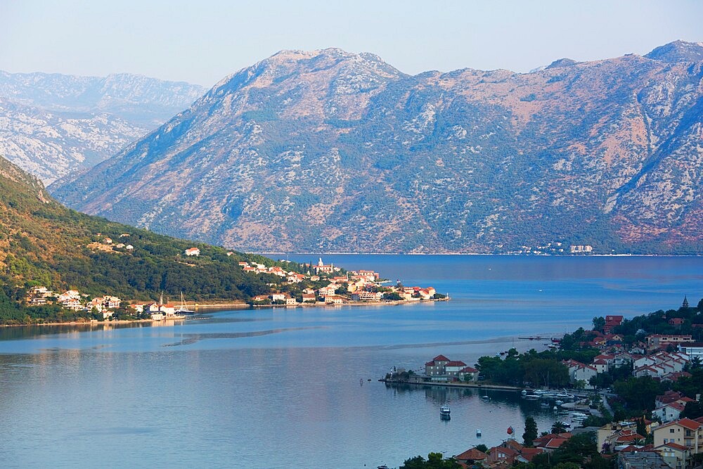 View over the Bay of Kotor from the town walls, early morning, the village of Prcanj prominent, Kotor, UNESCO World Heritage Site, Montenegro, Europe