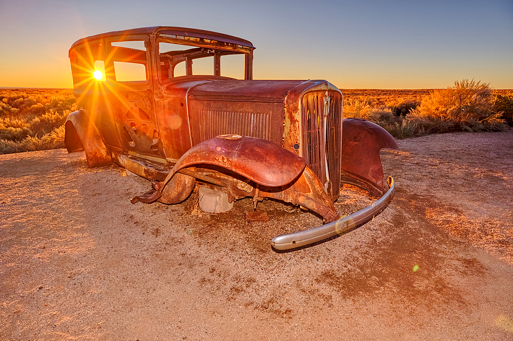 An old Model-T placed as a marker for the Route 66 Road Alignment in Petrified Forest National Park Arizona. The relic car is owned by the National Park Service and is public property. No Property release is needed.