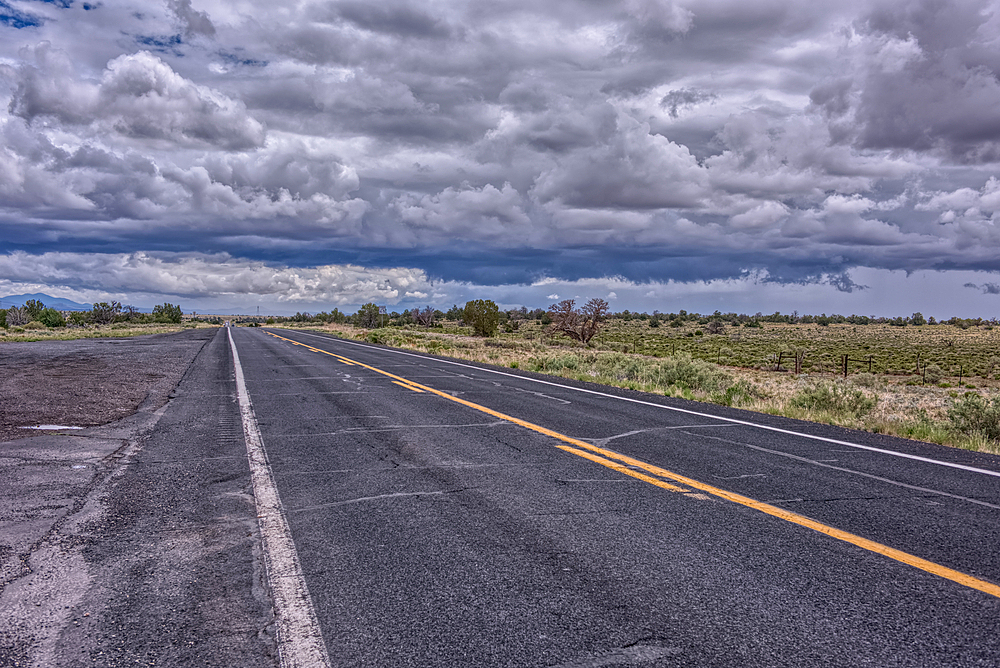 Storm clouds building over Arizona State Route 64, Arizona, USA