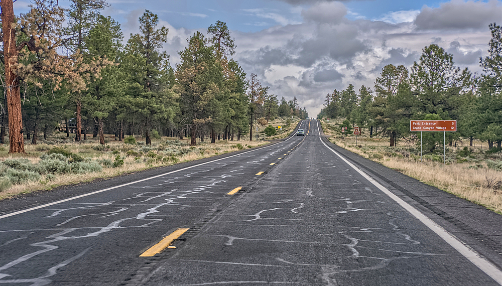 A sign along State Route 64 in Arizona marking 5 miles to Grand Canyon National Park, Arizona, USA