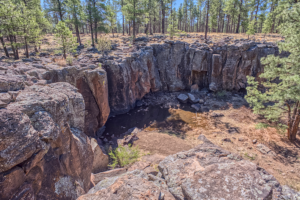 The cliff rim of Keyhole Sink in the Kaibab National Forest near Williams, Arizona, USA