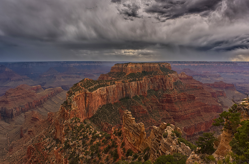 Storm rolling over Grand Canyon viewed from North Rim Arizona. The butte directly ahead is Wotans Throne.