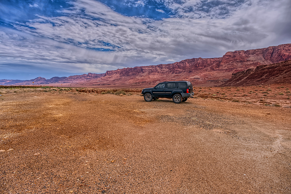 Vehicle parked next to Jackass Creek off of US89A near Echo Cliffs on the way to Vermilion Cliffs Arizona. Located on the Navajo Indian Reservation between Bitter Springs and Marble Canyon.