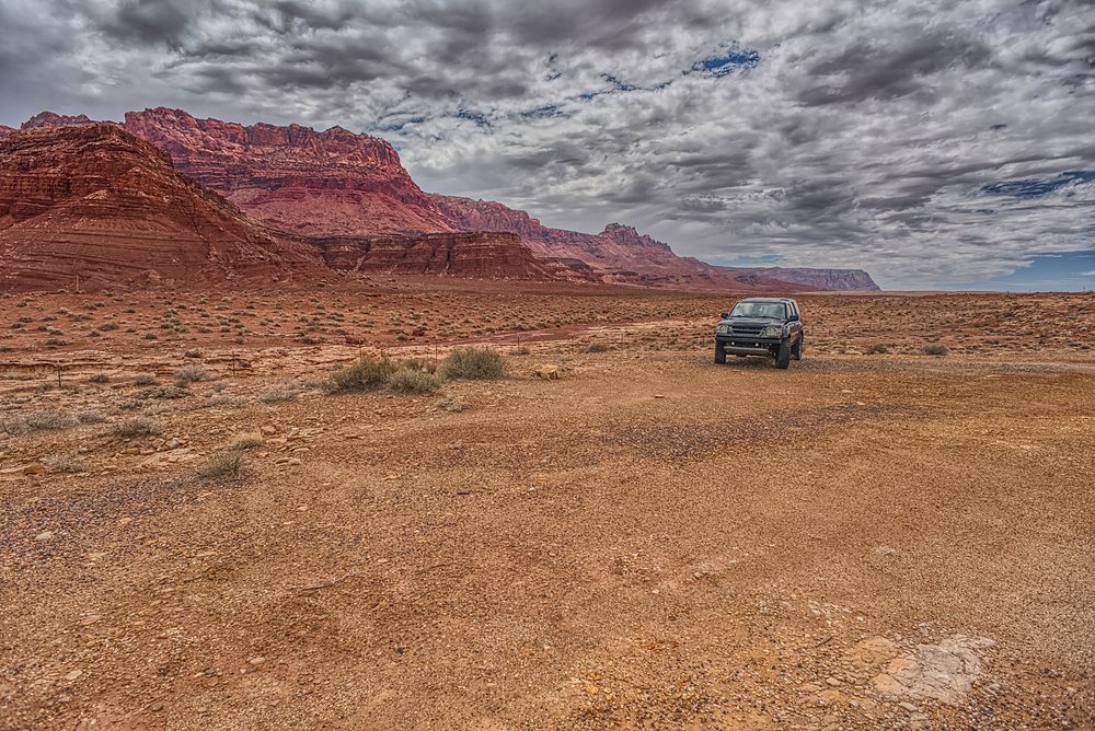 Vehicle parked next to Jackass Creek off of US89A near Echo Cliffs on the way to Vermilion Cliffs Arizona. Located on the Navajo Indian Reservation between Bitter Springs and Marble Canyon.