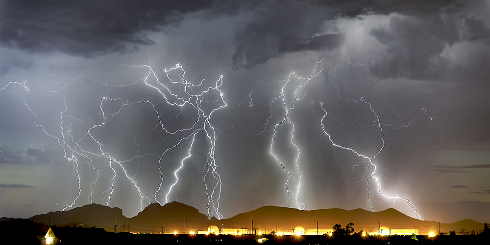 Lightning striking Saddleback Mountain just west of Tonopah, Arizona, United States of America, North America