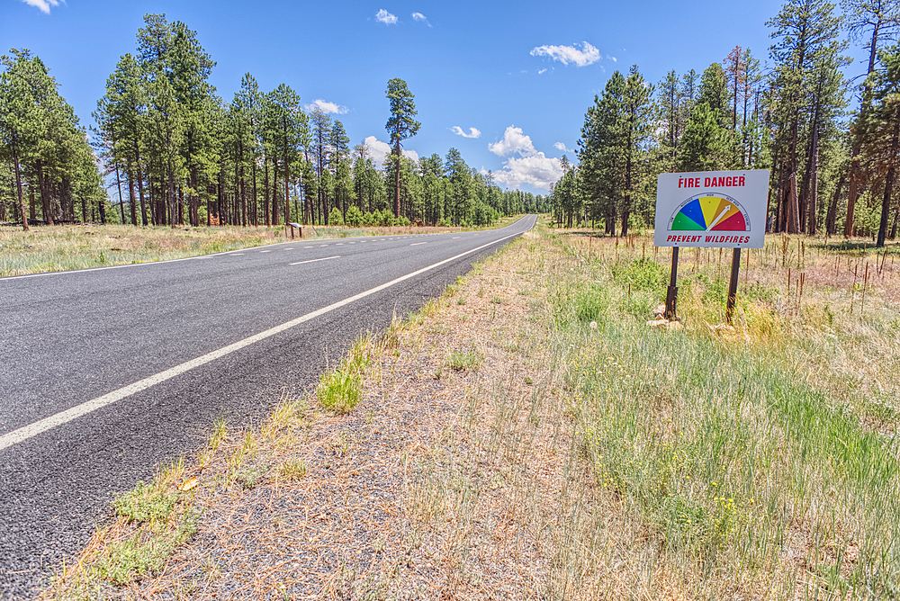 Taken on July 3rd, 2025, a warning sign of high wildfire danger along Highway 67 near Jacob Lake on the way to Grand Canyon North Rim Arizona. On July 4th, 2025, a massive wildfire broke out in this area from a lightning strike.